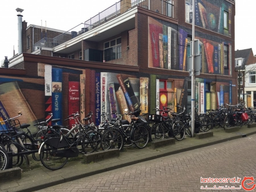 هنرمندان خیابانی، یک ساختمان معمولی را به یک قفسه کتاب دیدنی تبدیل کردند